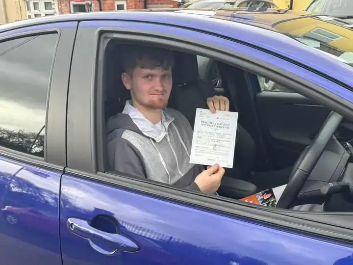 Brandon after passing the automatic driving test in Worcester